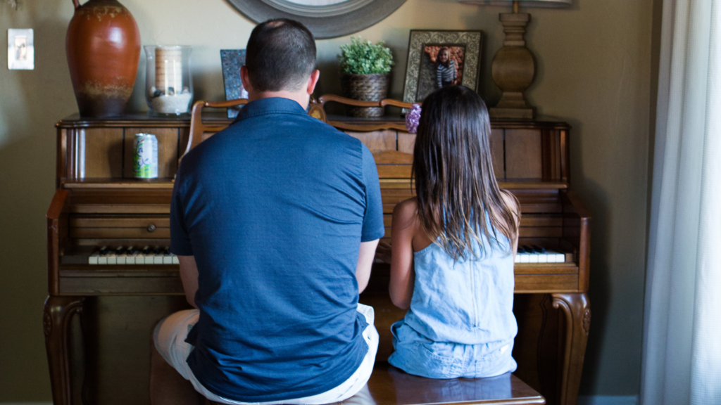 Adult and Child Playing Piano